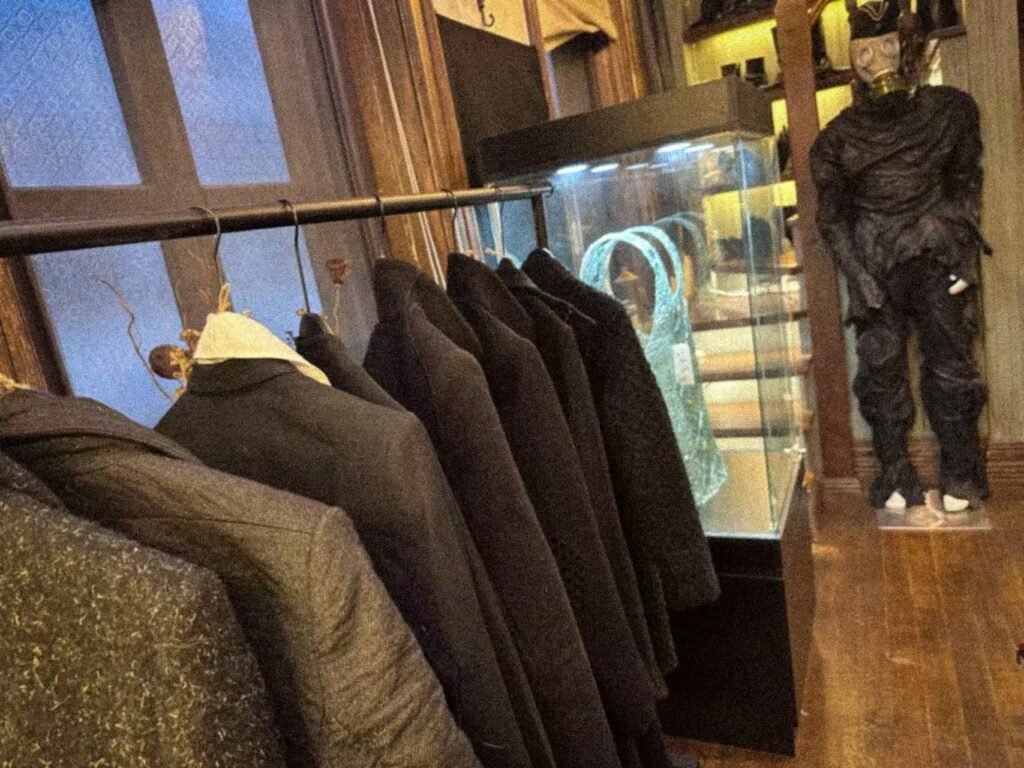 A garment rail, illuminated display case and mannequin at SECTION.